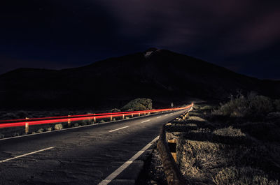 Light trails on country road at night