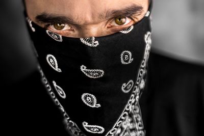 Close-up portrait of man face covered with napkin