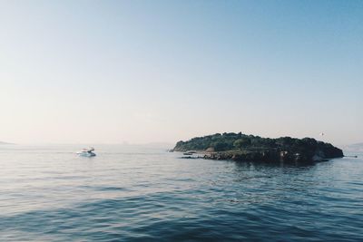 Boat in sea against clear sky