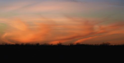 Scenic view of silhouette landscape against sky during sunset