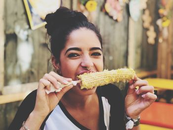 Portrait of woman eating food