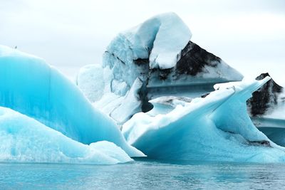 Scenic view of frozen lake against sky