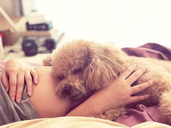 Close-up of man sleeping on bed at home