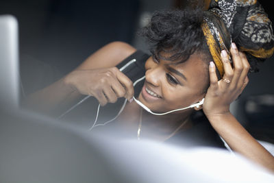 Young woman looking at her laptop