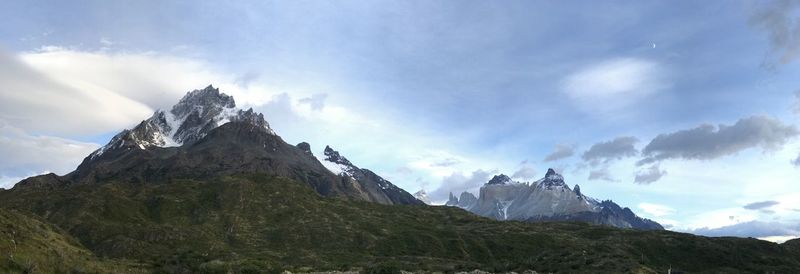 Scenic view of mountains against cloudy sky