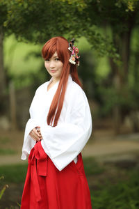 Portrait of woman in traditional clothes standing outdoors