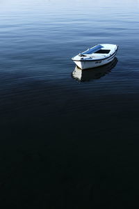 High angle view of boat moored in lake