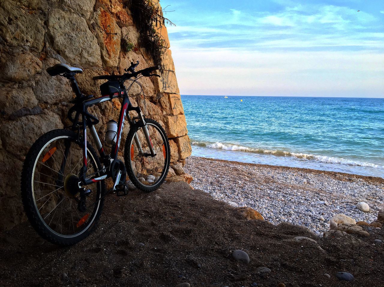 BICYCLES PARKED ON BEACH