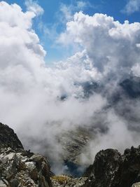 Low angle view of clouds over mountain