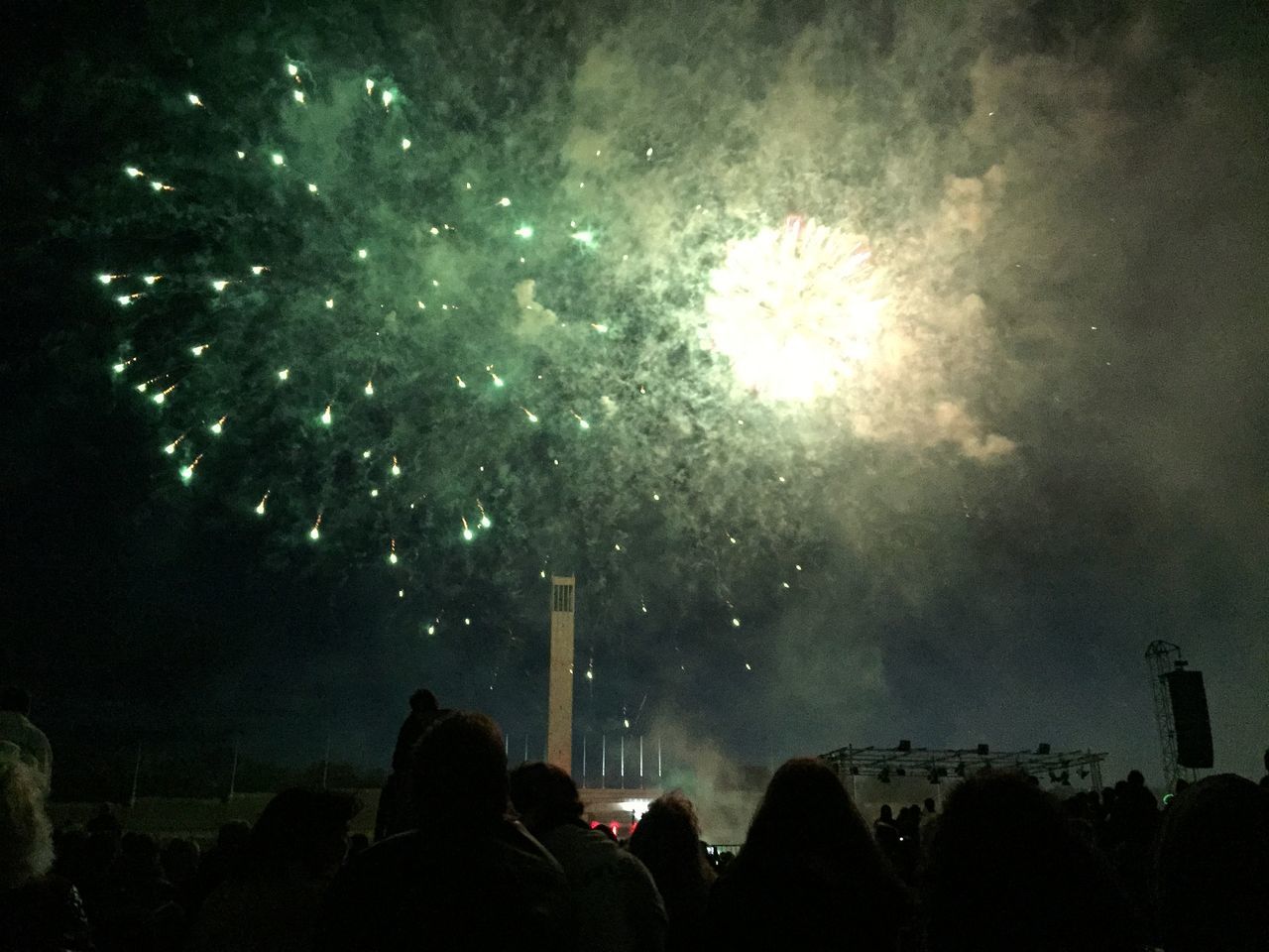 SILHOUETTE OF PEOPLE WATCHING FIREWORK DISPLAY