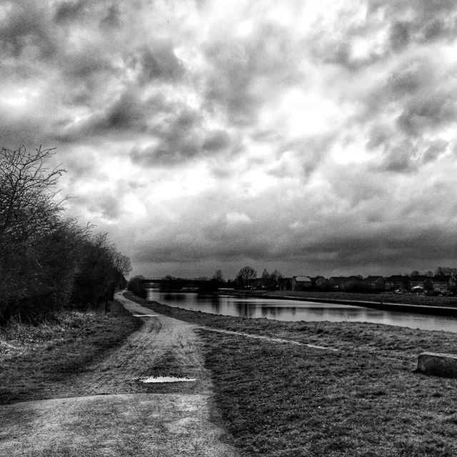 sky, cloudy, cloud - sky, the way forward, weather, water, road, overcast, tranquility, cloud, tranquil scene, diminishing perspective, nature, landscape, scenics, vanishing point, beauty in nature, built structure, day, river