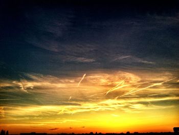 Scenic view of landscape against sky at sunset