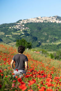 Rear view of man on grassy field