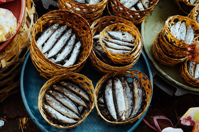 High angle view of cooked fish in basket for sale