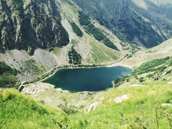 Scenic view of lake amidst mountains