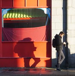 Low angle view of man standing in city