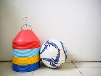 Close-up of multi colored ball against wall