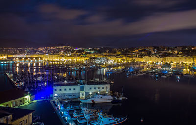 High angle view of illuminated city buildings at night