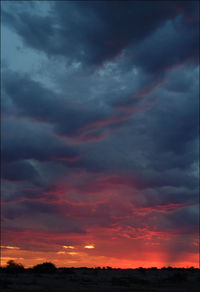 Scenic view of dramatic sky during sunset