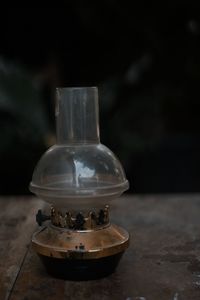 Close-up of glass bottle on table