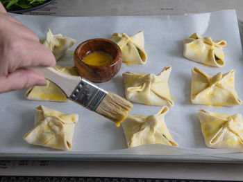 High angle view of person preparing food on table