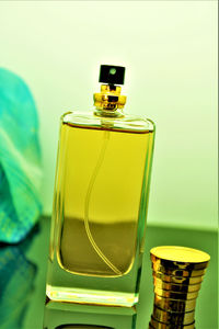 Close-up of yellow bottle on table