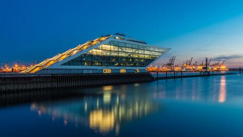 View of illuminated bridge against blue sky