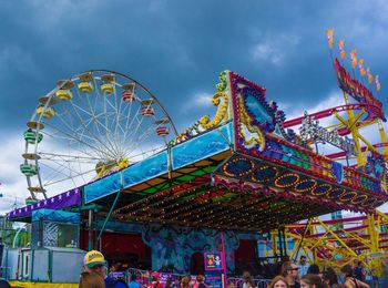 Low angle view of ferris wheel against sky