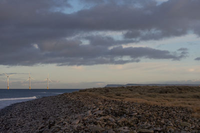 Scenic view of beach against sky