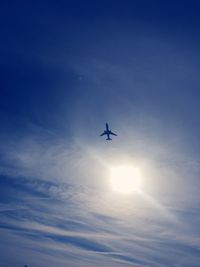 Low angle view of airplane flying in sky