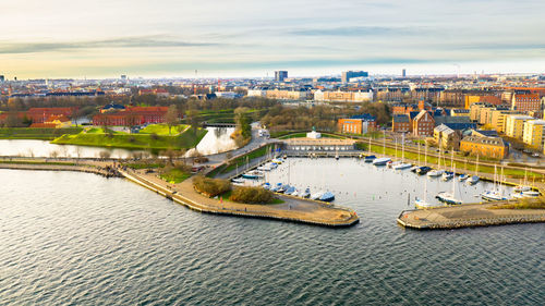 High angle view of river amidst buildings in city