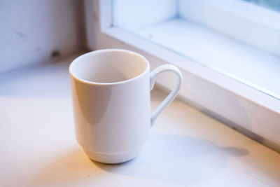 Close-up of coffee cup on table