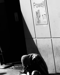 Low section of person standing on tiled floor