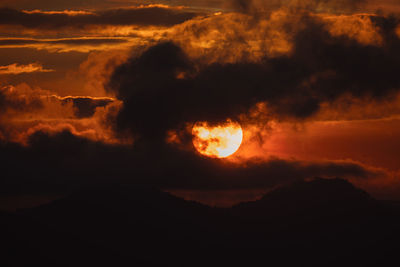 Scenic view of dramatic sky during sunset