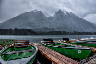 Boats moored at lake