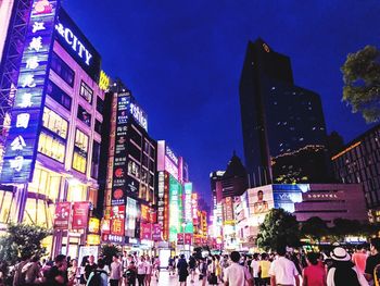 Crowd in city at night