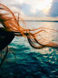 Woman with red hair, windy weather, freedom, ocean, sea, lake, nature 