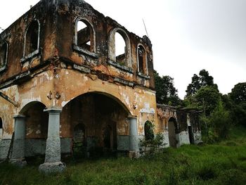 Low angle view of old ruin against sky