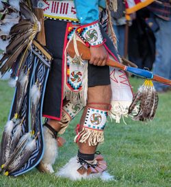 Low section of man in costume on field