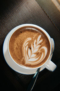 Close-up of cappuccino on table