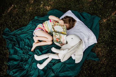 High angle view of woman resting on floor