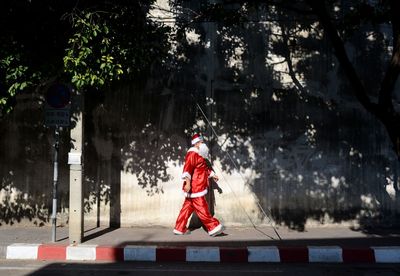 Full length of a man with cross on tree