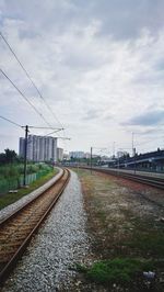 Surface level of railroad tracks against sky