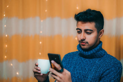 Young man using mobile phone