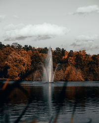 Scenic view of waterfall against sky