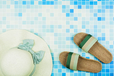 High angle view of hat on tiled floor