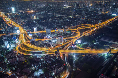 High angle view of illuminated buildings in city at night