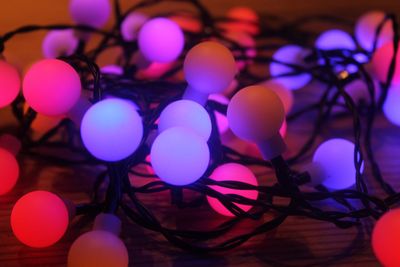 Close-up of illuminated lighting equipment on table