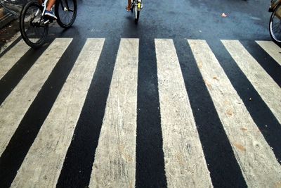 Shadow of people on road