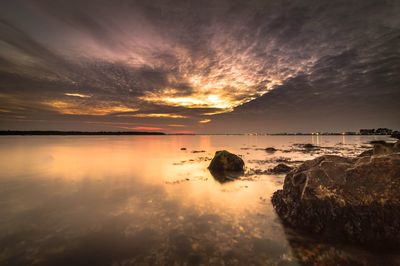 Scenic view of sea against cloudy sky